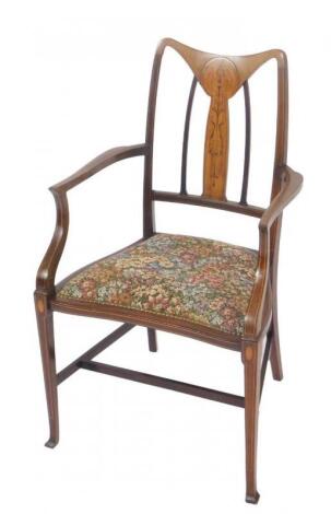 An Edwardian Art Nouveau rosewood and satinwood armchair