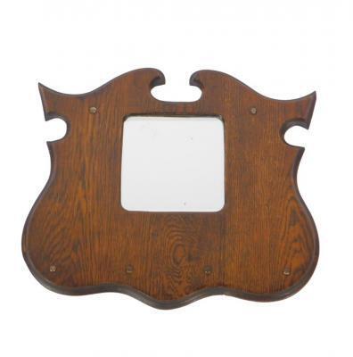 An early 20thC oak framed shield shaped wall mirror. 38cm H