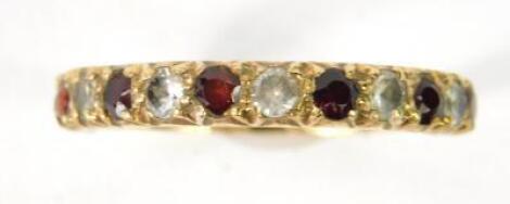 A ruby and zirconia half eternity ring