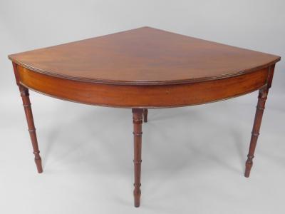 A George III mahogany corner table