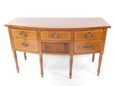 A George III mahogany and satinwood cross banded bow fronted sideboard