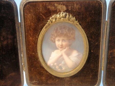 A Victorian leather cased photographic miniature of a child