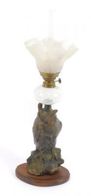 A cast metal oil lamp