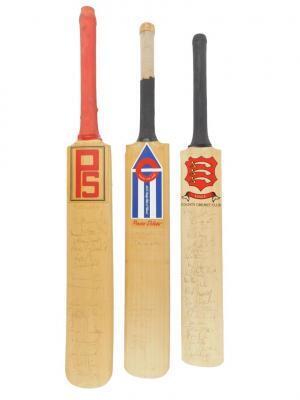 Three signed cricket bats