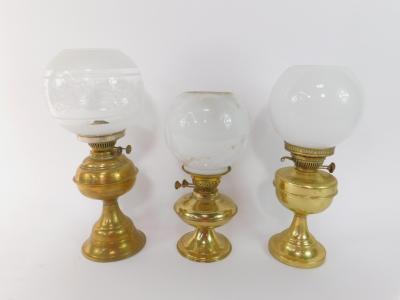 Three brass oil lamps