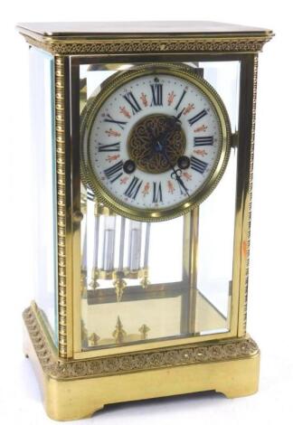 A late 19thC French brass four glass mantel clock