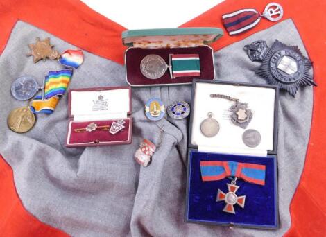 A collection of nursing medals badges etc.