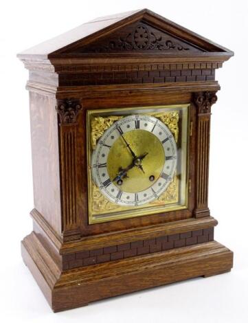 An early 20thC German oak mantel clock