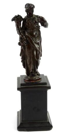 A 19thC Grand Tour type bronze figure of a lady holding a cornucopia of flowers