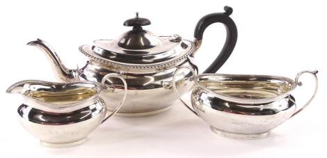 A George V silver three piece oval tea set