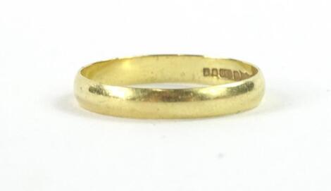 An 18ct gold plain designed wedding band