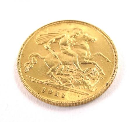 A 1911 half gold sovereign.