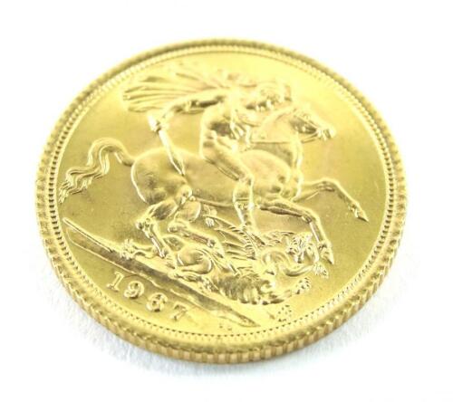 A 1987 full gold sovereign.