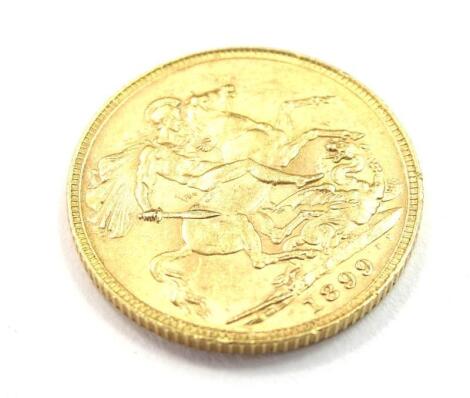 A Victorian 1899 full gold sovereign.