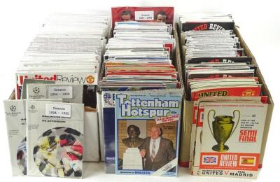 Two boxes of Manchester United home and away programmes