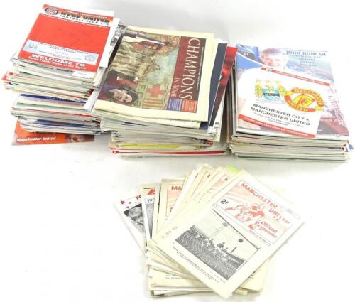 A quantity of Manchester United football programmes