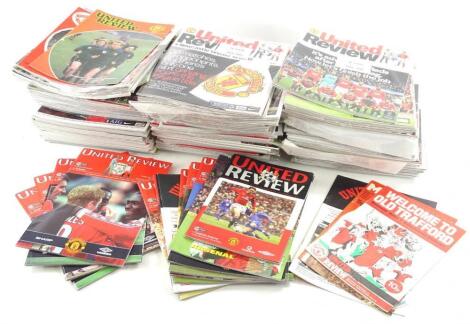 A quantity of Manchester United home football programmes