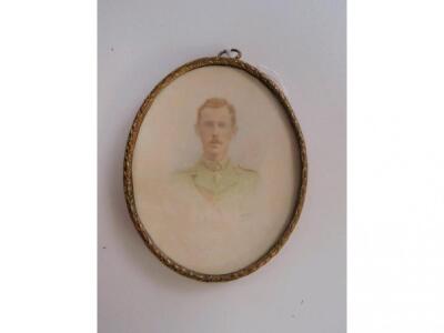 A gilt framed photographic portrait miniature of an Army Officer