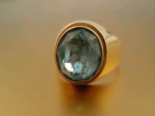 A signet ring set with a pale blue paste to lightweight and repaired or