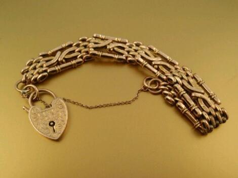 A fancy link gate bracelet stamped 9ct