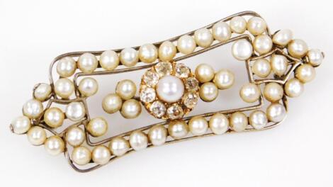 An Edwardian 18ct white gold diamond pearl and yellow metal brooch