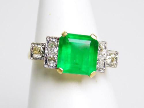 An 18ct emerald and diamond Art Deco style ring