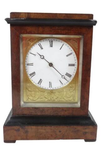 A late 19thC burr walnut ebonised cased mantel clock