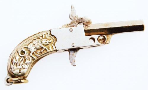 A 20thC pistol shaped pendant