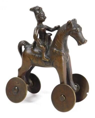 A polished Eastern bronze type equestrian figure temple toy