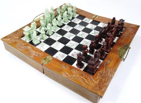 A 20thC carved wooden chess board