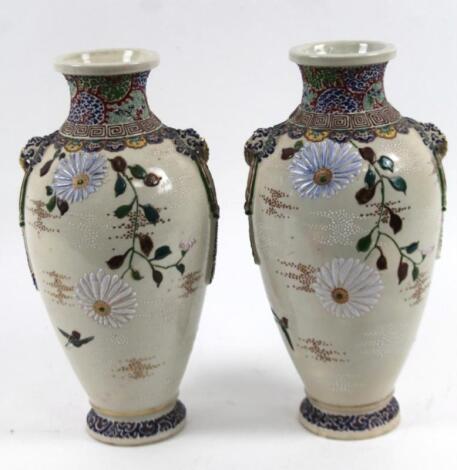 A pair of 20thC Japanese pottery vases