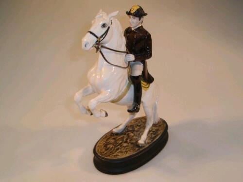 A Beswick equestrian figure group of a Lipizzaner of the Spanish Riding School