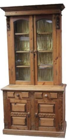 A stripped and lightly polished pine bookcase