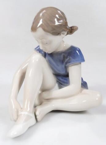 A Royal Copenhagen figure of a seated girl