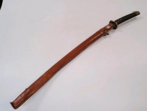 A Samurai sword with leather sheathed scabbard