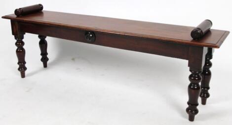 A Victorian mahogany bench of rectangular outline with scroll handles on turned supports