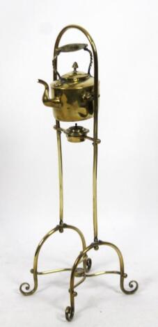 An early 20thC brass spirit kettle on stand