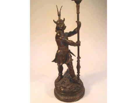 A spelter table lamp, modelled as a Viking Warrior, 54cm high