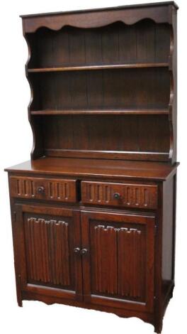 A Ercol style dark wood dresser