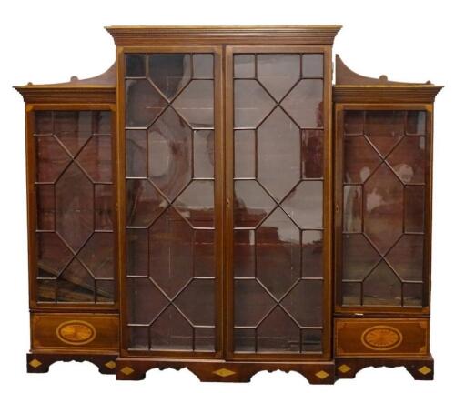 An Edwardian mahogany breakfront bookcase