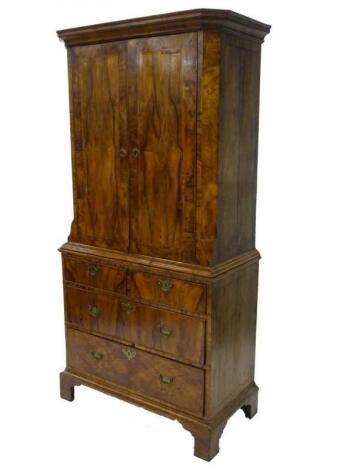 A late 19thC/early 20thC Dutch walnut and feather banded cabinet