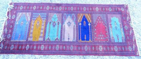 A Persian style multi mihrab prayer rug