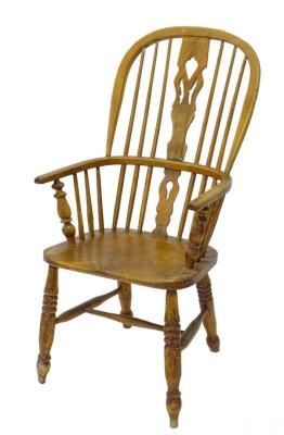 A 19thC ash and elm Windsor chair with a pierced splat