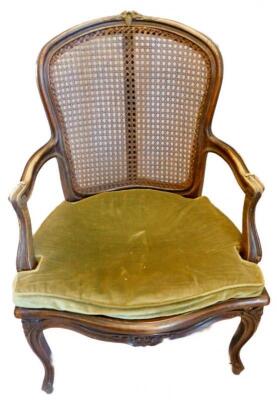 A late 19thC French beech open armchair