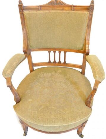 A late 19thC walnut tub shaped armchair