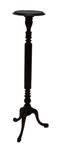 A mahogany torchere