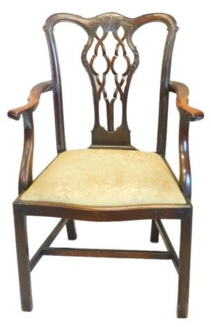 A mahogany open arm chair in George III style