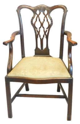 A mahogany open arm chair in George III style