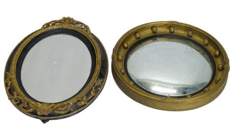 A 19thC ebonised and gilt gesso over wall mirror