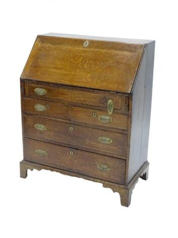 A 19thC oak and mahogany cross-banded bureau